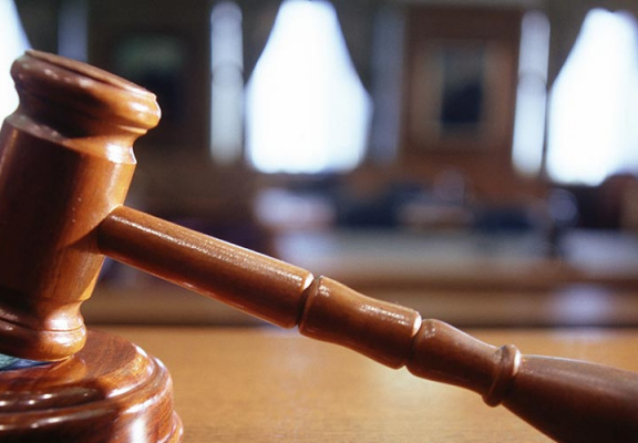 Close up of gavel in boardroom or court house.